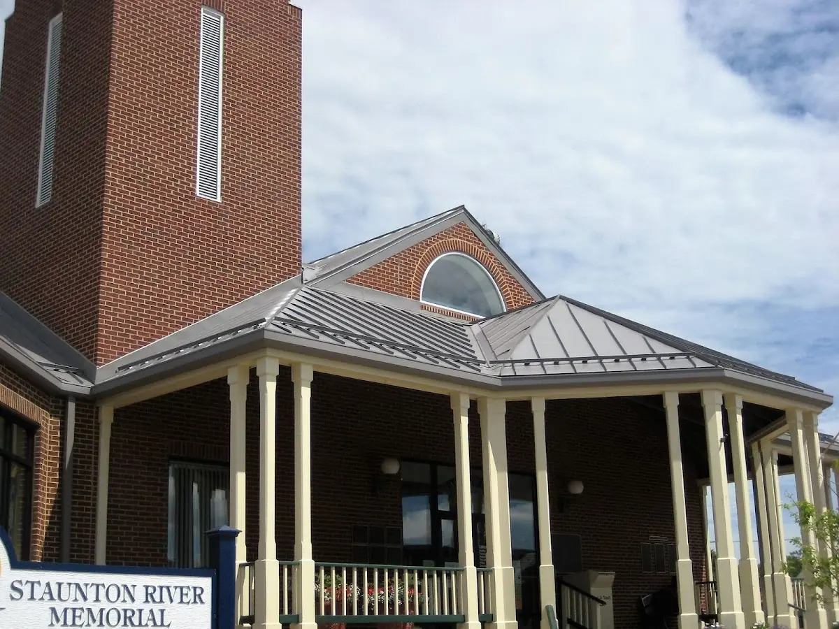 Skilled roofing craftsmen working on a residential roof in Vickery